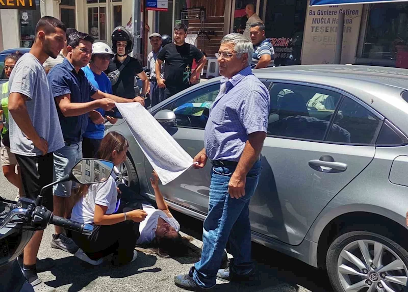 Vatandaşlar yaralı kadın sürücüyü güneşten havluyla korudu
